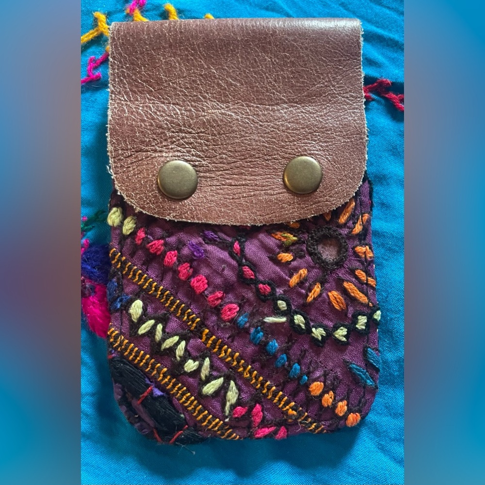 Free people purple card case. Measures approximately 4 x 5”. New!